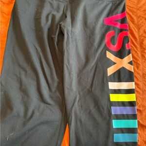 VSX Sport Black Leggings with Multicolor Logo and a floral pair of workout capri